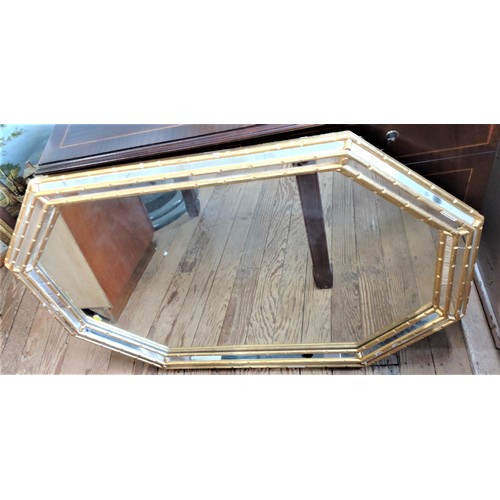 67 - An octagonal mirror. 110 x 77cm