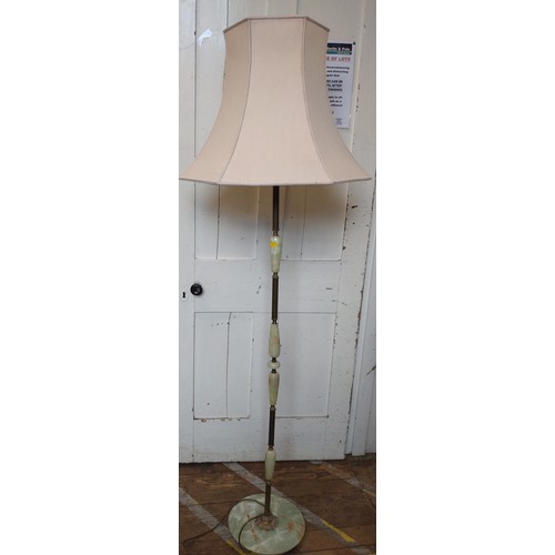 64 - An onyx standard lamp