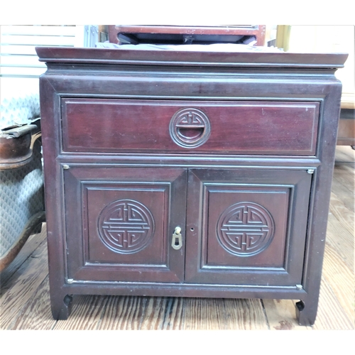 537 - A Vintage Chinese Rosewood Side Cupboard. Fitted with a single drawer above a pair of cupboard doors... 