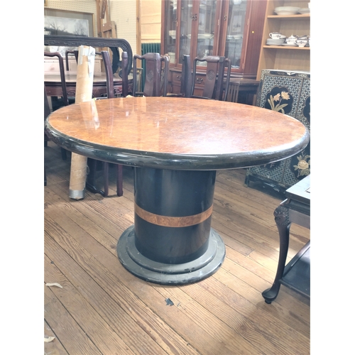 541 - A large Art deco Style Circular Table. Circa 1970. Supported on a large cylindrical column with step... 