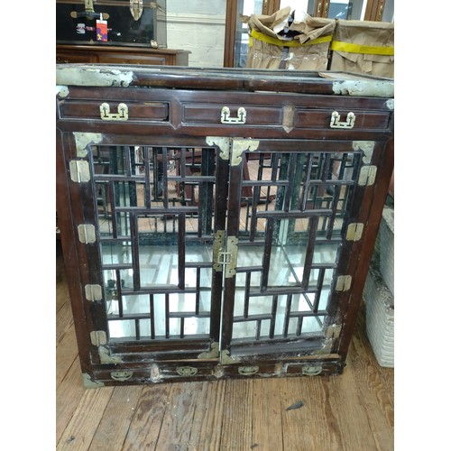 542 - A Chinese rosewood fretwork mirrored cabinet. 96 x 89 x 44cm