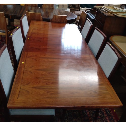 543 - A Danish Rose Wood dining table and six chairs circa 1980. 71cm x 165cm x 100cm unextended but can b... 