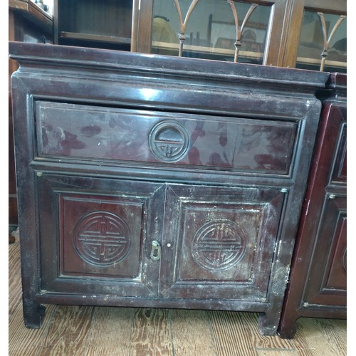 538 - A Vintage Chinese Rosewood Side Cupboard. Fitted with a single drawer above a pair of cupboard doors... 