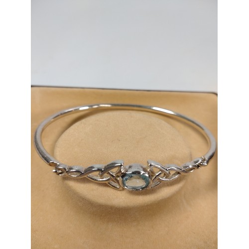 1045 - Two silver bracelets set with stones in a box.