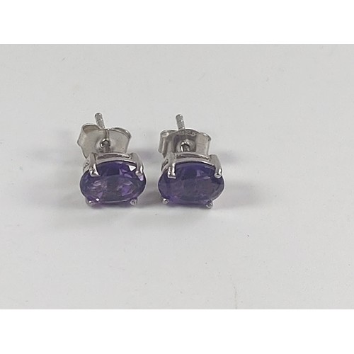 1063 - A pair of Amethyst studs in silver.