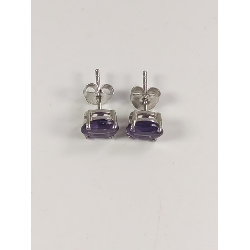 1063 - A pair of Amethyst studs in silver.