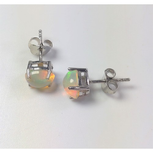 1068 - A pair of Ethiopian white opal studs in silver.