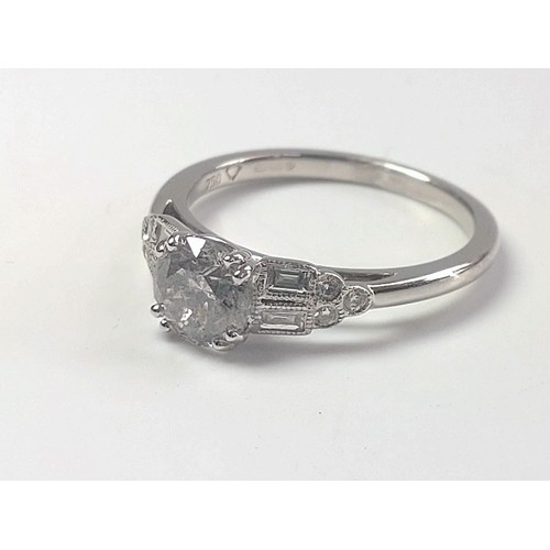 1070 - An 18ct white gold diamond solitaire ring set with Round Brilliant Cut and baguette cut diamond shou... 