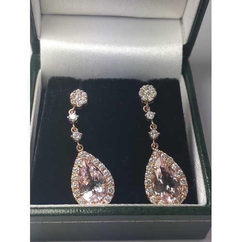 1071 - A pair of 18ct rose gold pear shaped morganite and Round Brilliant Cut diamond drop earrings, boxed,... 