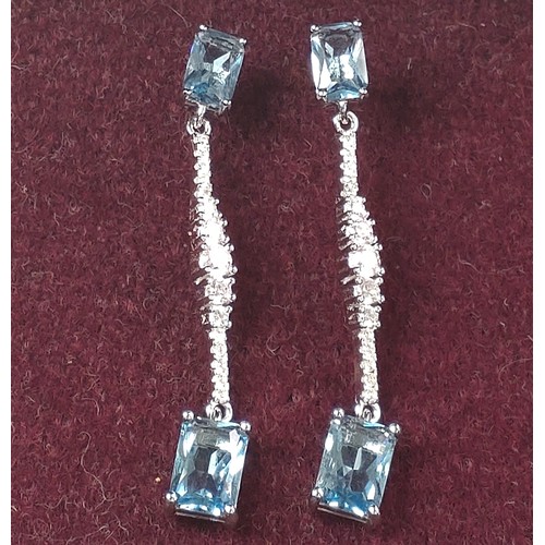 1080 - A pair of stylish silver drop earrings set with rectangular light blue CZ and graduating R/C white C... 