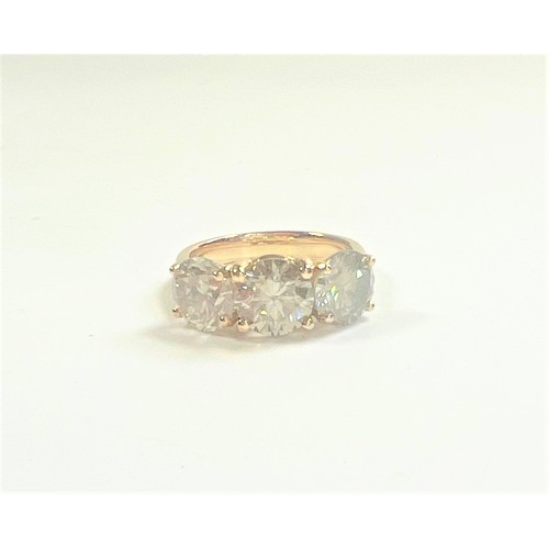 1076 - An 18ct yellow gold round brilliant diamond trilogy ring. Diamonds 4.79ct. original WGI Cert no. WGI... 