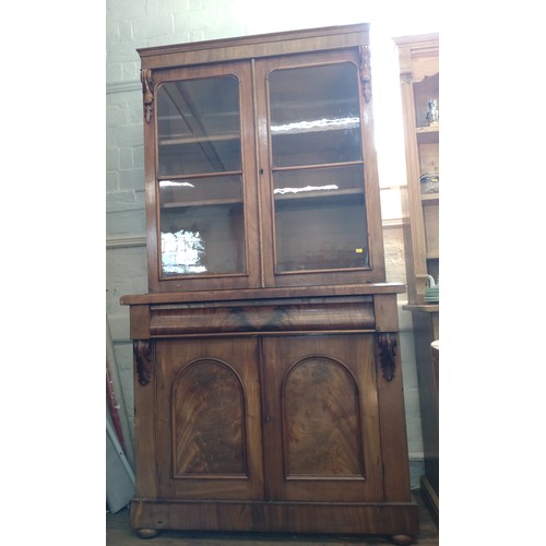 72 - A Victorian Mahogany Bookcase. Circa 1850. Fitted with a pair of glazed doors enclosing shelves. All... 