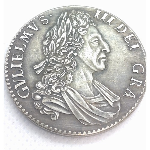 513 - A reproduction William III crown dated 1700. 26.4gms.