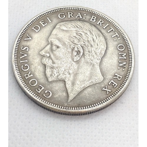 520 - A reproduction George V crown, dated 1934. 24.2gms.