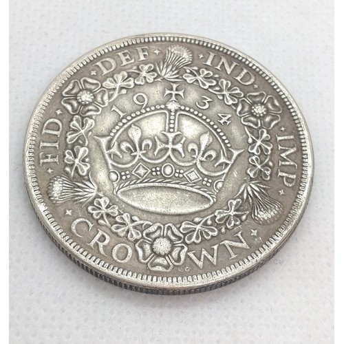 520 - A reproduction George V crown, dated 1934. 24.2gms.