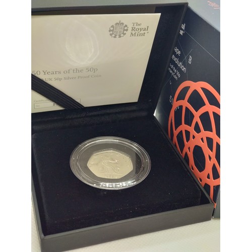 450 - A Royal Mint sterling silver 50th anniversary of the 50p coin with packaging.