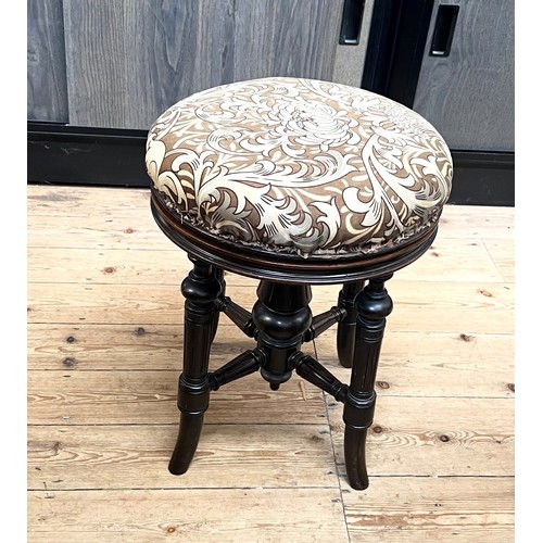 68 - A Victorian upholstered piano stool. late 19th century.