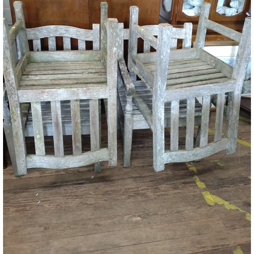 61 - An octagonal wooden garden table (71cm x 130cm x 130cm) and six chairs