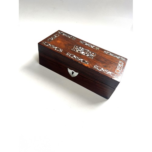 71 - Rosewood box. Circa 1860. Of rectangular for. With mother of pearl inlay.