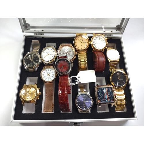 434 - A collection of twelve fashion watches in a presentation case