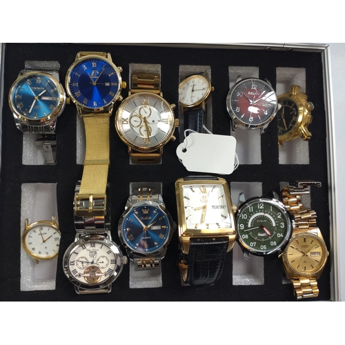 435 - A collection of twelve fashion watches in a presentation case