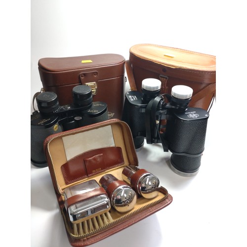 116 - Two pairs of binoculars and a gentleman's grooming case