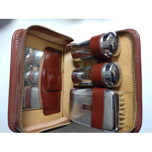 116 - Two pairs of binoculars and a gentleman's grooming case