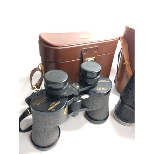 116 - Two pairs of binoculars and a gentleman's grooming case