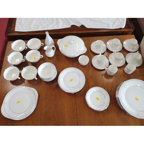 175 - Royal Doulton 5084 Carnation pattern dinner service (lacks coffee pot). (56)