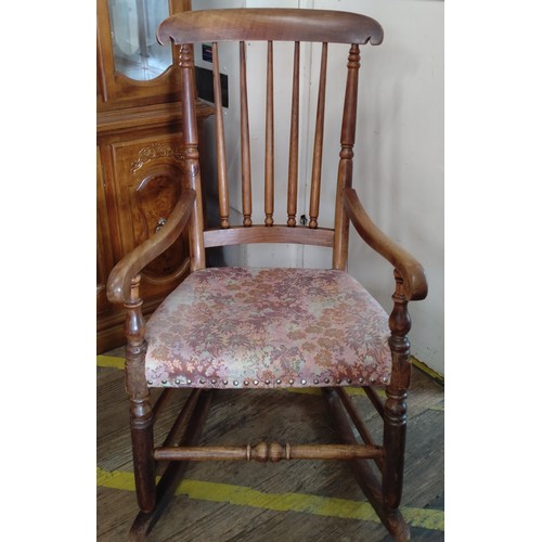 60 - A rocking chair with upholstered seat