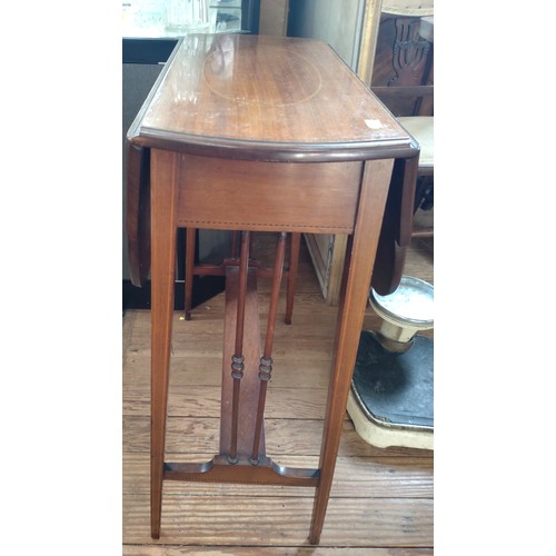 63 - A folding occasional table. 70cm x 56cm x 26cm (86cm extended)