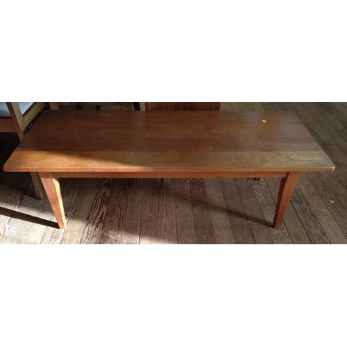 64 - A teak coffee table. 38cm x 128cm x 52cm