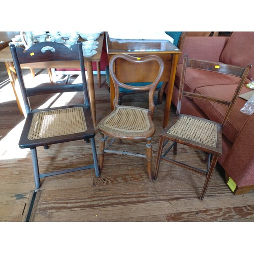 62 - Three wicker seated chairs