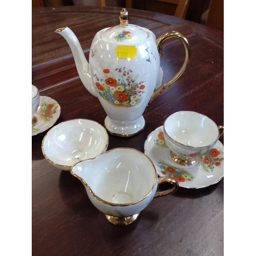 172 - A lustre coffee set with floral decoration and a part tea service (lacks teapot). (34)