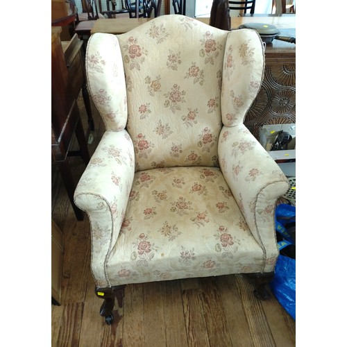 78 - An Antique Wing Back Upholstered Arm chair.