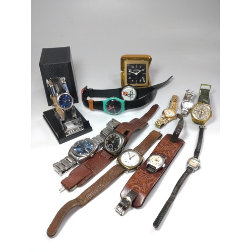 448 - A collection of eleven watches and a travel clock. Watches including a tissot Automatic Seastar (197... 