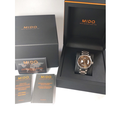 326 - A gentlemen's Mido automatic day/date on a stainless steel bracelet with original box and papers.