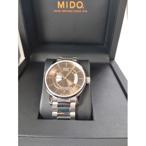 326 - A gentlemen's Mido automatic day/date on a stainless steel bracelet with original box and papers.