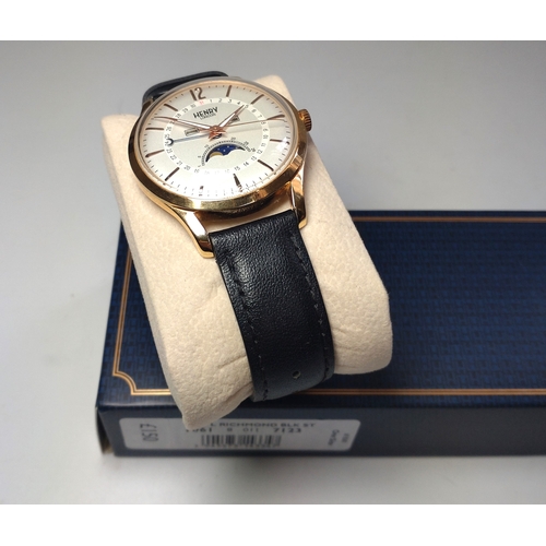 327 - A gentlemen's Henry moon phase day/date on a leather strap with original box and papers.