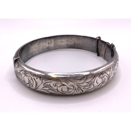 281 - A silver hinged bangle / bracelet, hallmarked Chester 1958, inscribed 'Phyllis from Mother', interna... 