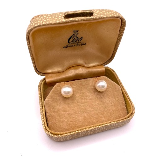 287 - A pair of 9ct yellow gold and pearl ear studs, set with cultured pearls approximately 8 mm diameter.