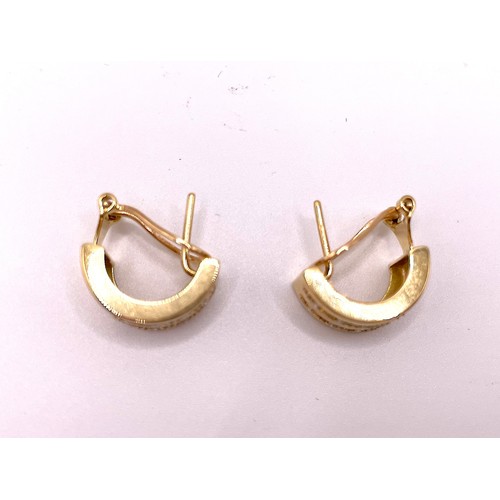 289 - A pair of 18ct yellow gold 'cuff' earrings, each inset with two rows of round brilliant-cut diamond ... 