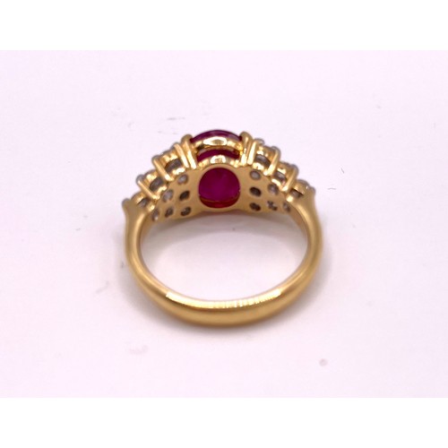 308 - An 18ct yellow gold, diamond, and ruby ring, set with a mixed oval-cut ruby, of approximately 3.50 c... 