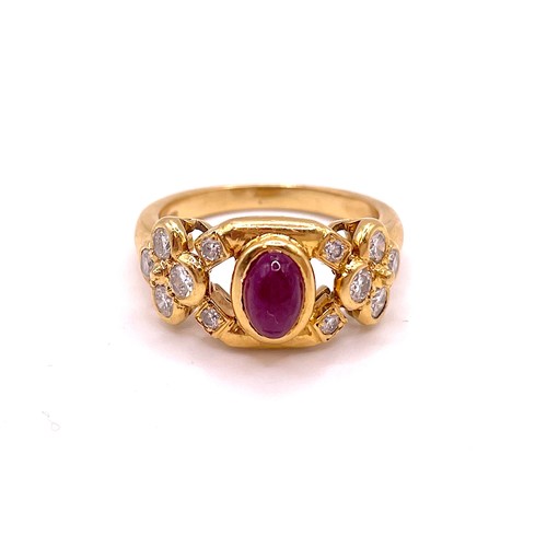 286 - An 18ct yellow gold, diamond, and ruby ring, set with an oval cabochon ruby, the shoulders set with ... 