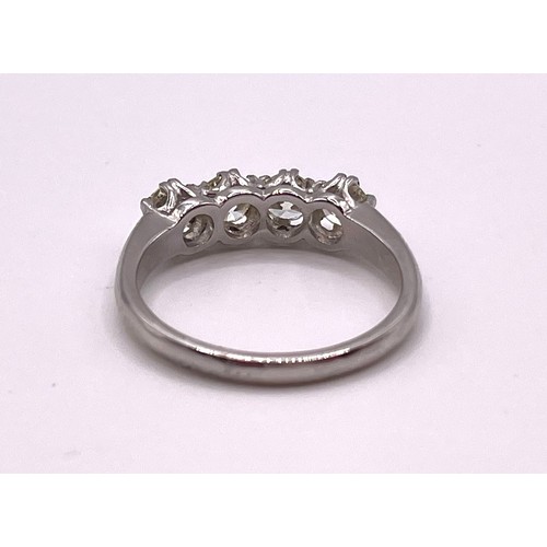 284 - A platinum and diamond four stone ring, set with four round brilliant-cut diamonds of approximately ... 