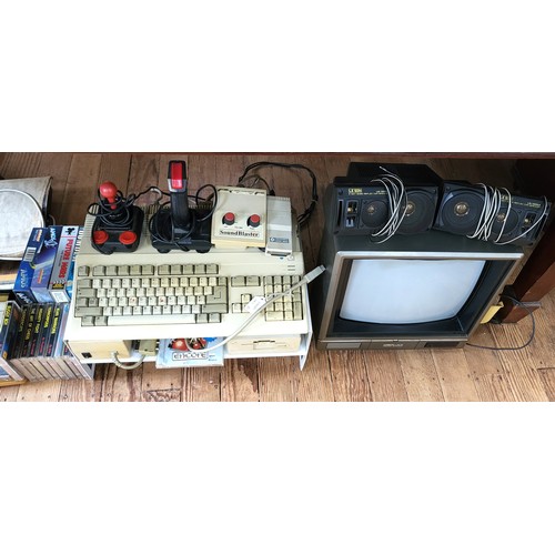 78 - An AMIGA Games Consul, x14 games plus accessories with a Fidelity monitor.
Including in this Lot is ... 