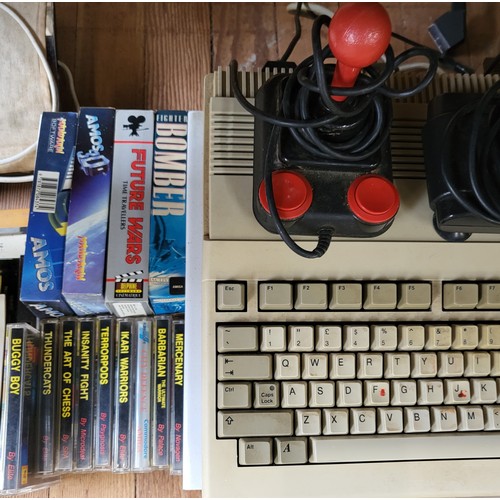 78 - An AMIGA Games Consul, x14 games plus accessories with a Fidelity monitor.
Including in this Lot is ... 