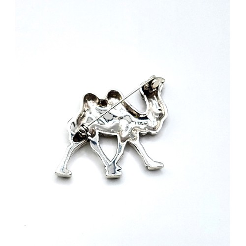 263 - A silver brooch in the form of a Bactrian camel, marked 'sterling' to verso, 4.1 cm wide.