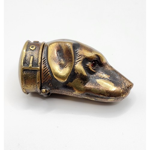 264 - A novelty brass vesta case in the form of a dog's head.