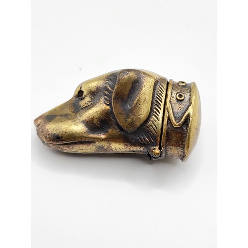 264 - A novelty brass vesta case in the form of a dog's head.